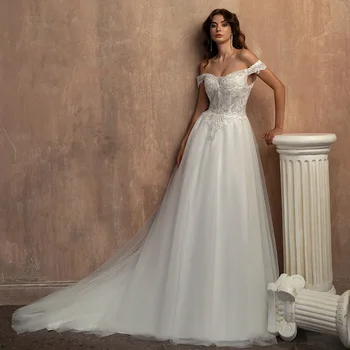 Gyönyörű fehér menyasszonyi ruha Applique Off the Shoulder Lace Sequins Beaded Pearl A-line földig érő esküvői ruha 웨딩드레스